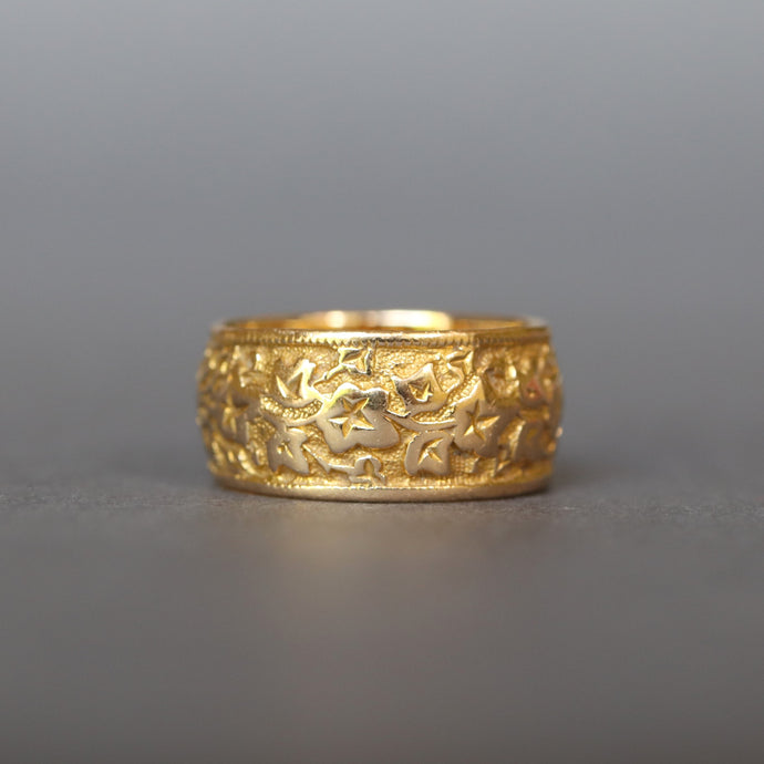 Antique Victorian era wide gold stacking band ring in 18ct gold. Antique wedding ring with embossed ivy leaf design around full circumference. Ivy leaf symbolising fidelity, loyalty, devotion. Anniversary gift ring.