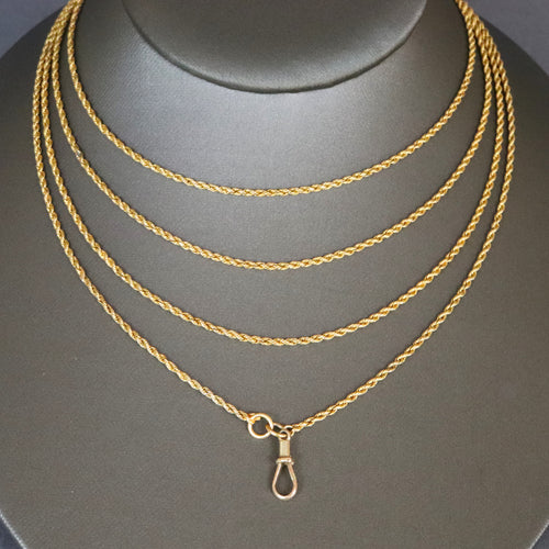 Long guard chain. Antique chain. Antique gold chain. Muff chain. Antique guard chain. Rope link chain. Antique rope link chain. Twist link chain. Antique twist link chain. Swivel clasp. Lobster clasp. Gold dog clip. Antique dog clip. Charm holder.