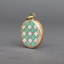 Load image into Gallery viewer, Antique blue green enamel locket. Antique enamel locket. Blue green enamel geometric locket. Victorian enamel locket. Victorian blue green enamel locket. Engraved ivy locket. Antique gold locket. Antique blue green enamel pendant. Antique enamel pendant. Victorian enamel pendant. Victorian blue green enamel pendant. Seafoam green enamel locket. Mint green enamel locket.
