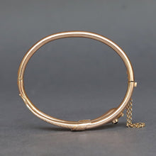 Load image into Gallery viewer, Antique snake bypass bangle with garnet in 14ct gold
