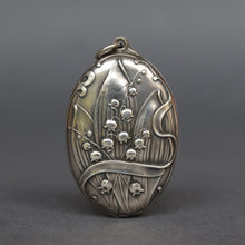 Load image into Gallery viewer, Antique art nouveau slide locket with double sided mirror. Locket with lily of the valley decoration. Large art nouveau silver locket. Repousse art nouveau locket.
