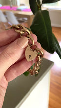 Load and play video in Gallery viewer, Antique chunky curb link bracelet with heart padlock in 9ct gold
