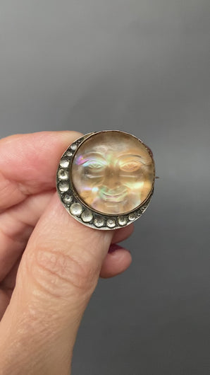 Man in the moon brooch. Antique man in the moon brooch. Victorian man in the moon brooch. Moon man brooch. Antique man in the moon pin. Man in the moon pin. Saphiret glass. Saphiret glass brooch. Opalescent glass. Opalescent glass brooch. Crescent moon brooch. Paste brooch.