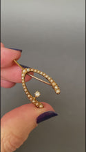 Load and play video in Gallery viewer, Antique Victorian era diamond &amp; pearl wishbone brooch in 15ct gold
