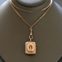 Load image into Gallery viewer, Antique Victorian era horseshoe locket in 14ct gold casing
