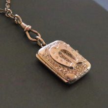 Load image into Gallery viewer, Antique Victorian era horseshoe locket in 14ct gold casing
