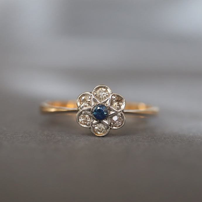 Vintage ring. Daisy ring. Cluster ring. Flower ring. Diamond cluster ring. Diamond daisy ring. Diamond flower ring. Vintage cluster ring. Vintage flower ring. Vintage daisy ring. Edwardian daisy ring. Edwardian ring. Antique ring. Antique flower ring. Antique cluster ring. Antique daisy ring. Engagement ring. Diamond engagement ring. Vintage engagement ring. Antique engagement ring. Blue spinel ring. Blue spinel daisy ring. Blue daisy ring.