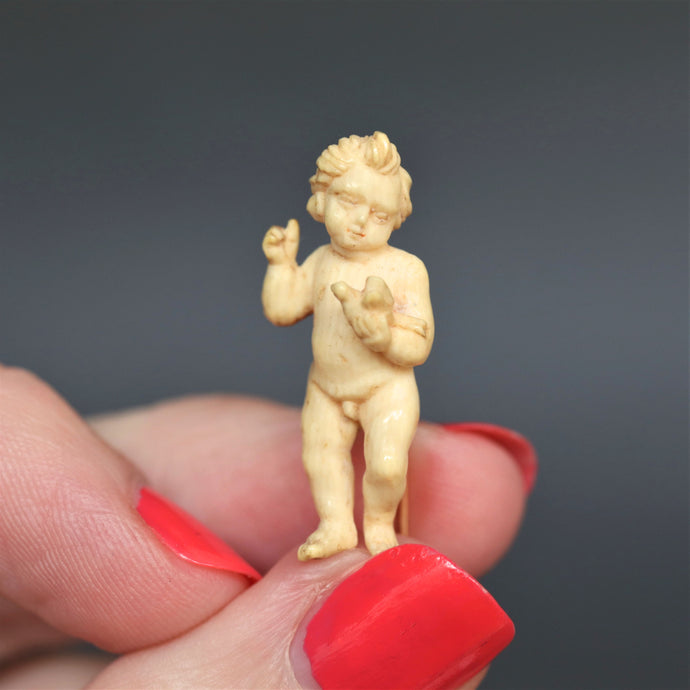 Antique putti. Antique cherub. Antique angel. Putti pin. Ivory putti pin. Cherub pin. Ivory cherub pin. Angel pin. Ivory angel pin. Cherub and dove. Putti and dove. Carved ivory pin. Antique ivory pin. 