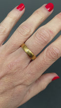 Load and play video in Gallery viewer, Antique Victorian era wedding band with engraving in 18ct gold
